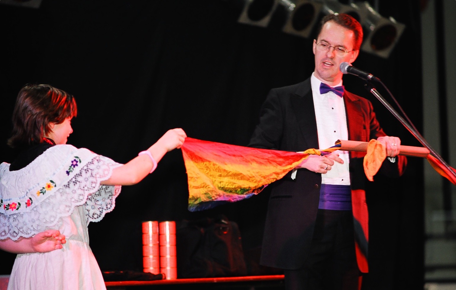 Richard Young the Magician and his rainbow streamer production